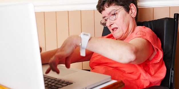 Disabled person working on a laptop, photo.