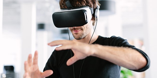 A person using VR glasses. Photo.
