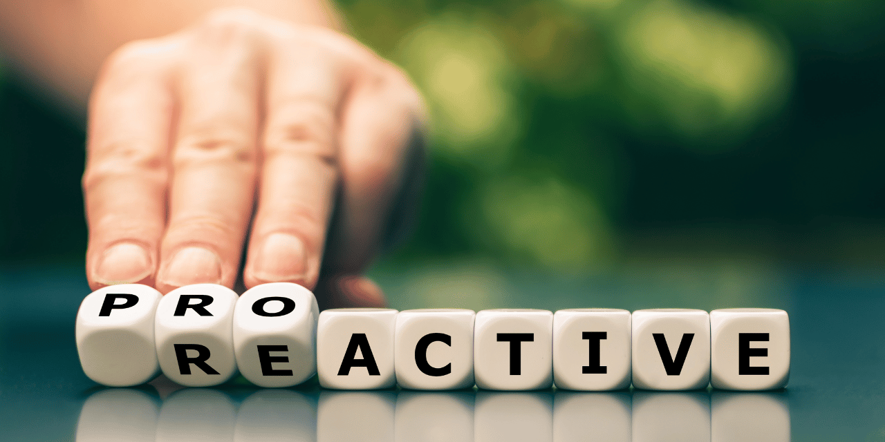 Dice with letters showing the word proactive.