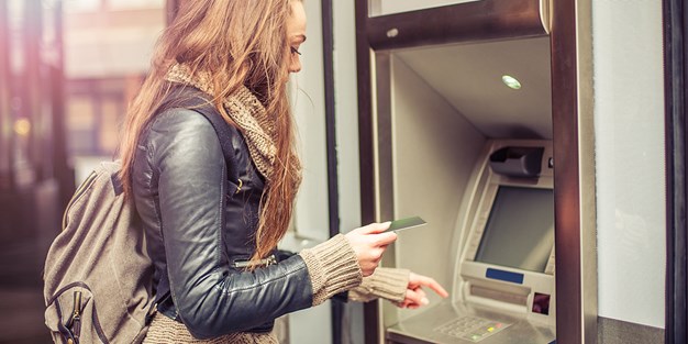 A person using a self-service machine. Photo