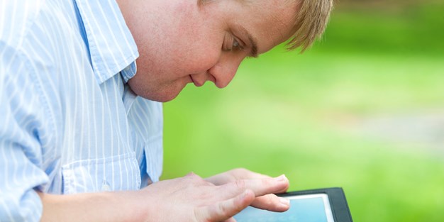 A boy with a tablet. Photo