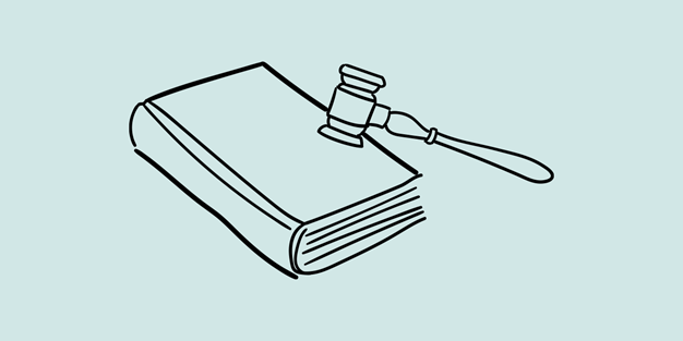 En lovbok og en dommerhammer. Illustrasjon